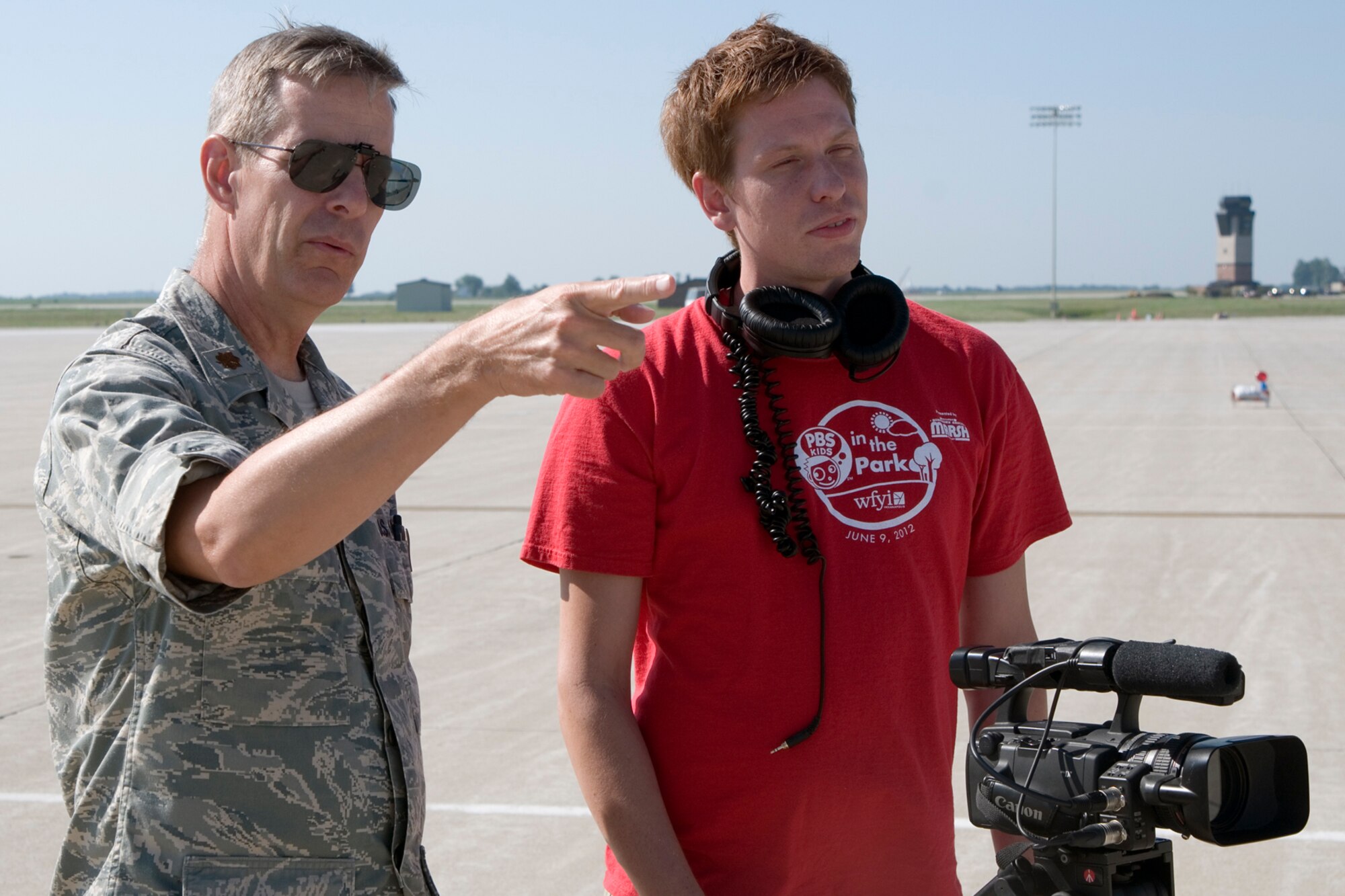 GRISSOM AIR RESERVE BASE, Ind. -- Maj. Shane Toomay, 434th Maintenance Squadron maintenance officer, points out the specifics of a KC-135R Stratotanker to Josh Lozinak, an intern with WFYI Productions, here Aug. 1. Indiana media outlets converged on Grissom to experience an aerial refueling flight and learn about the base. (U.S. Air Force photo/Senior Airman Andrew McLaughlin)

