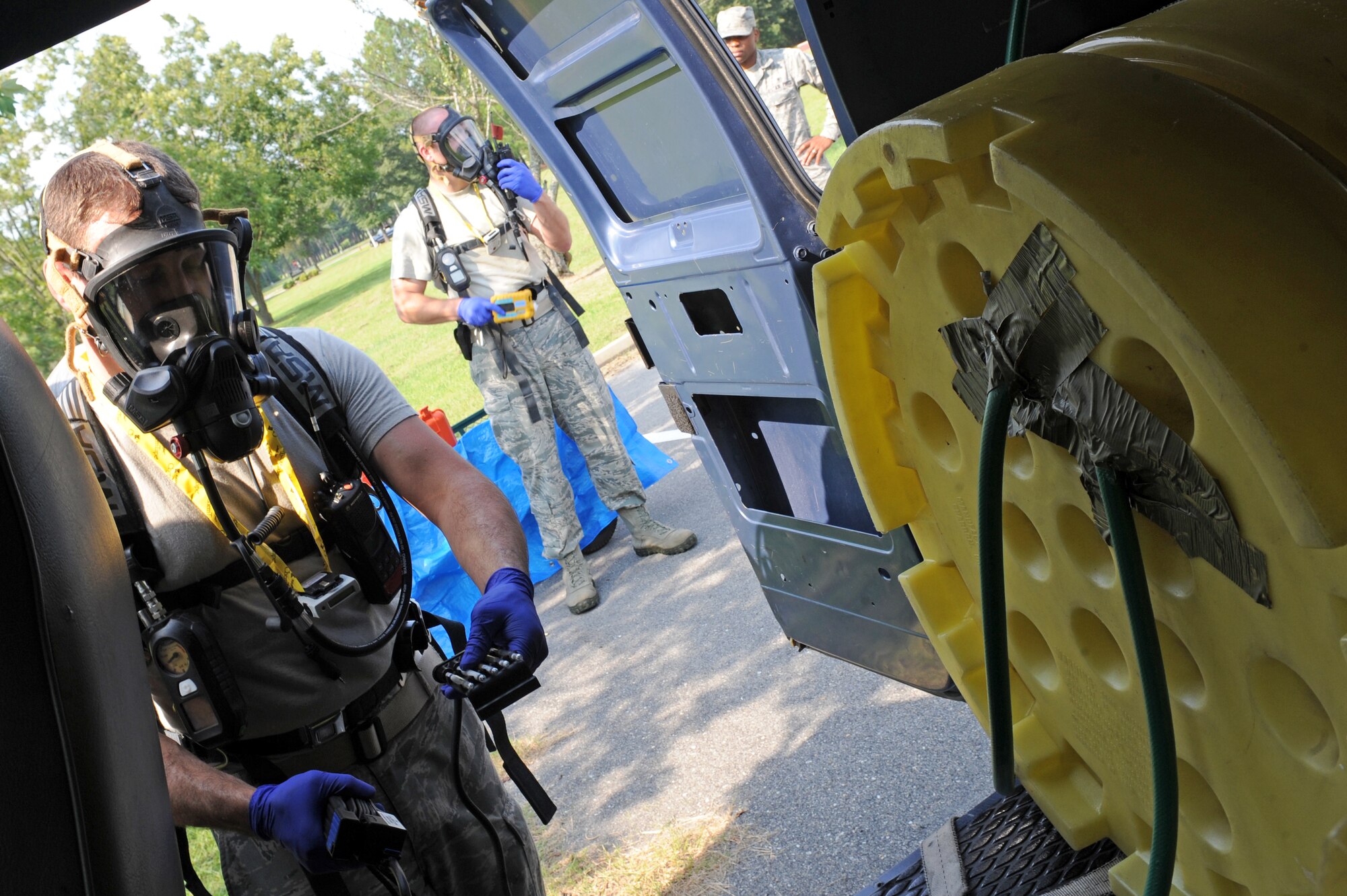U.S. Air Force Senior Airman James Boone, 4th Medical Group bioenvironmental engineer, checks for chemical agents inside a van during an exercise on Seymour Johnson Air Force Base, N.C., Aug. 14, 2012. The exercise tested how well Airmen and base personnel reacted to an attack that involved a chemical agent. (U.S. Air Force photo/Airman 1st Class John Nieves Camacho/Released)