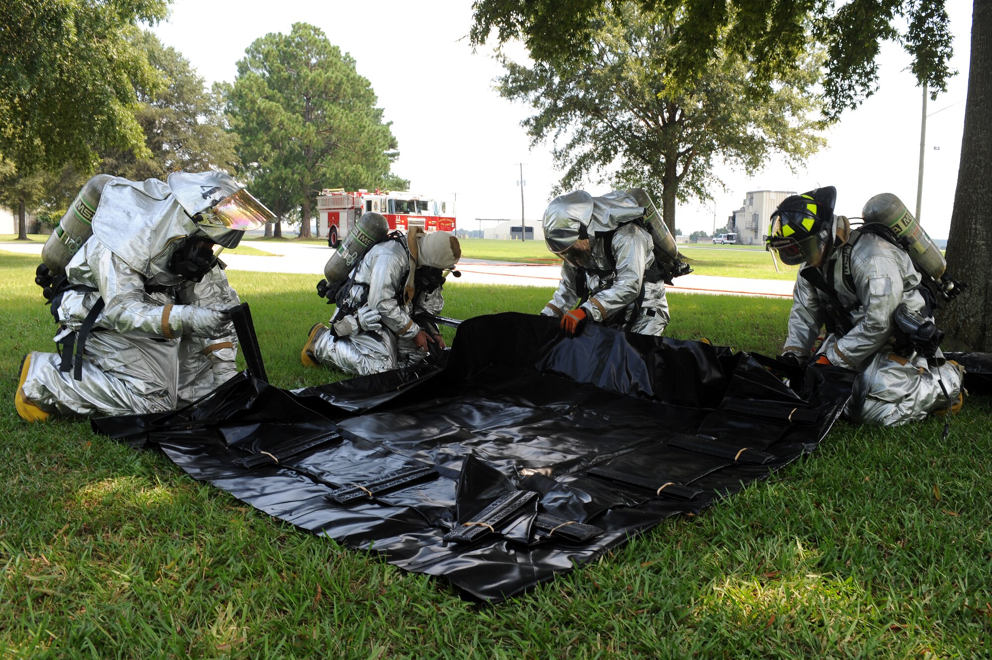 Airmen from the base fire emergency services flight set up a decontamination area during an exercise on Seymour Johnson Air Force Base, N.C., Aug. 14, 2012. During the exercise, the base was exposed to a simulated chemical agent and personnel who were contaminated went through a decontamination area to rid themselves of the agent. (U.S. Air Force photo/Airman 1st Class John Nieves Camacho/Released)