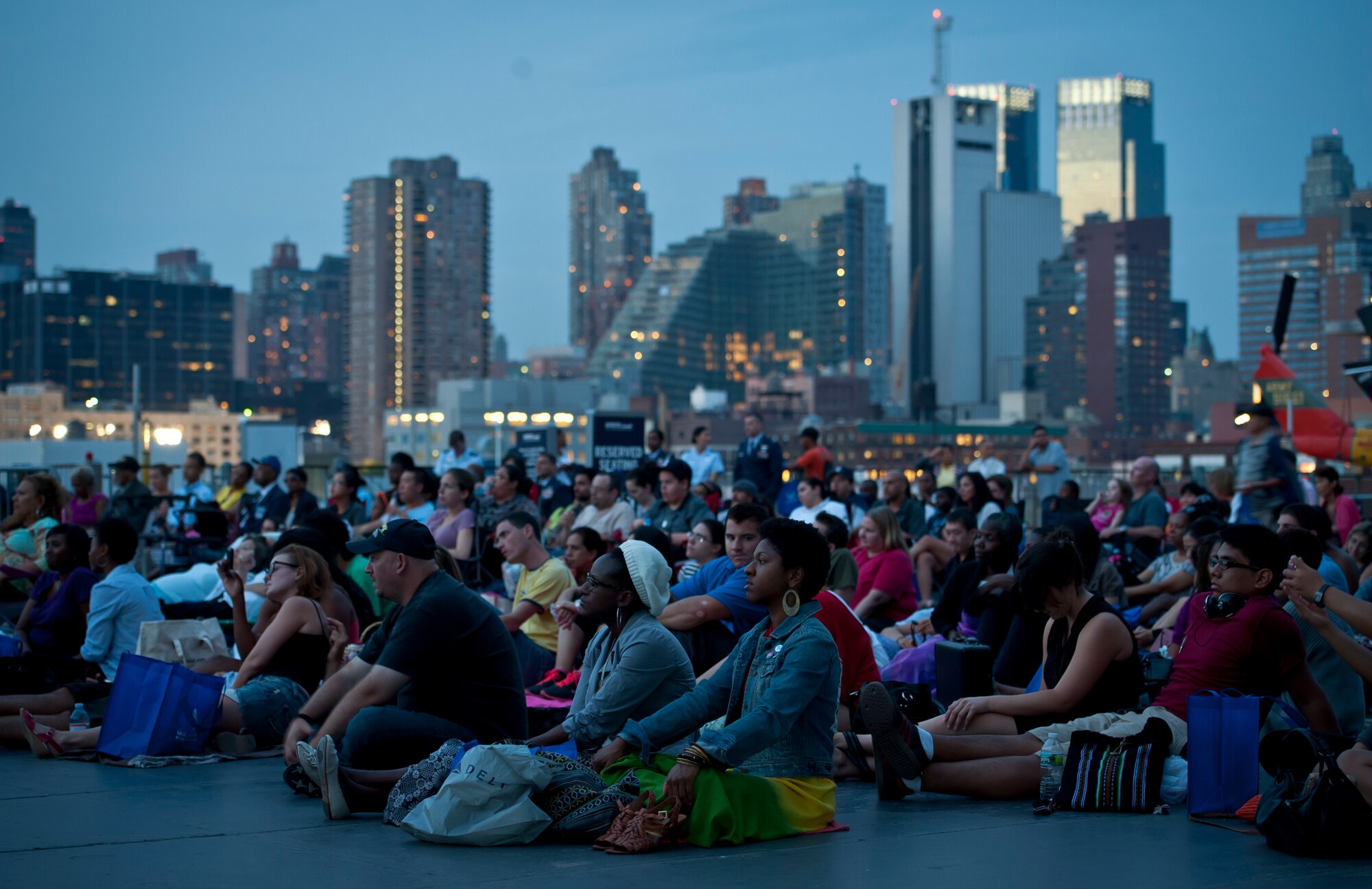 United States Air Force officials, local residents and tourists wait for the movie, Red Tails, to play at Pier 86 during 2012 Air Force Week in New York City, on August 20, 2012. The movie represented Tuskegee Airman missions in World War II. More than five Tuskegee Airman were present for the event. (U.S. Air Force photo/Senior Airman Andrew Lee)