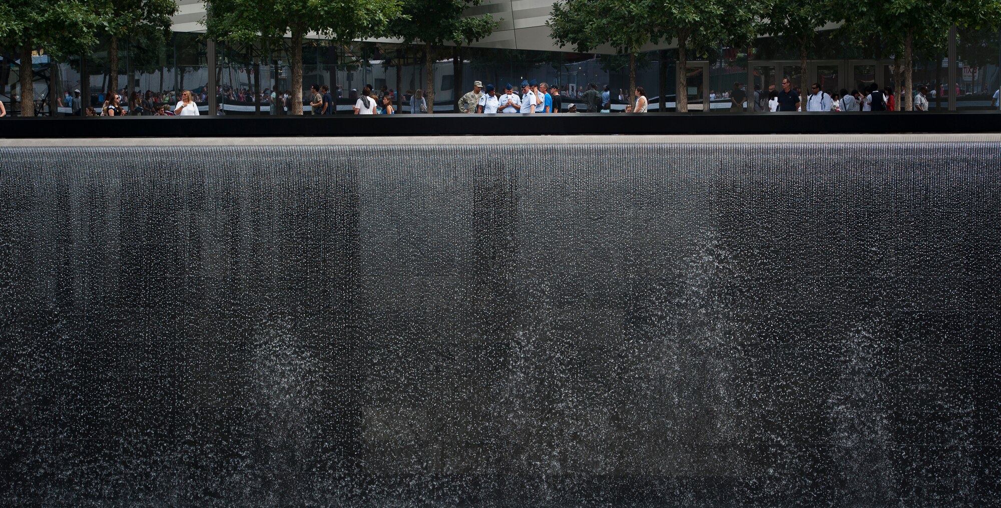 Airmen from Joint Base McGuire-Dix-Lakehurst, N.J., take photos of the newly finished 9/11 Memorial in New York City, on August 20, 2012. (U.S. Air Force photo/Senior Airman Andrew Lee)