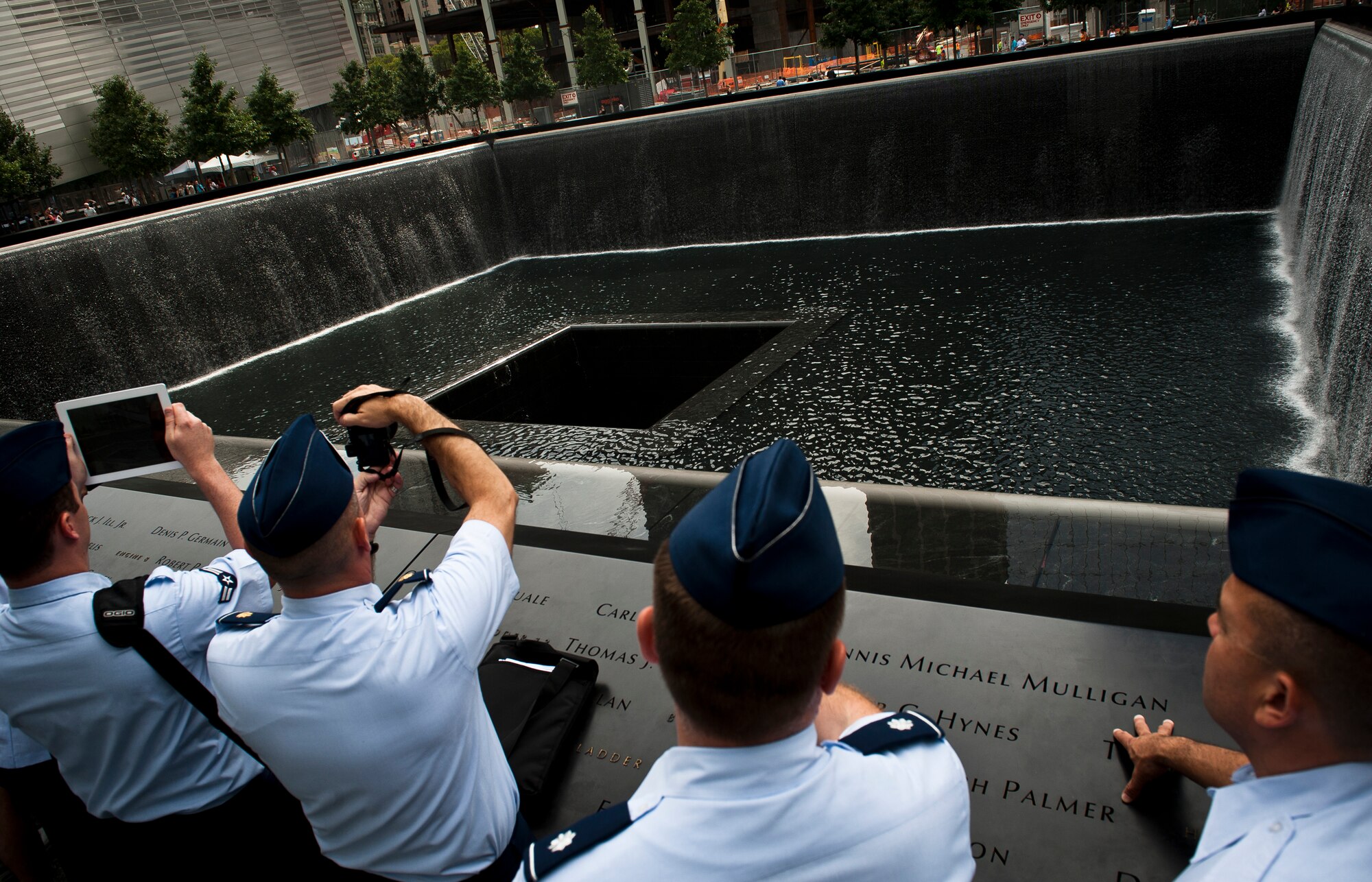 Airmen from Joint Base McGuire-Dix-Lakehurst, N.J., take photos of the newly finished 9/11 Memorial in New York City, on August 20, 2012. (U.S. Air Force photo/Senior Airman Andrew Lee)