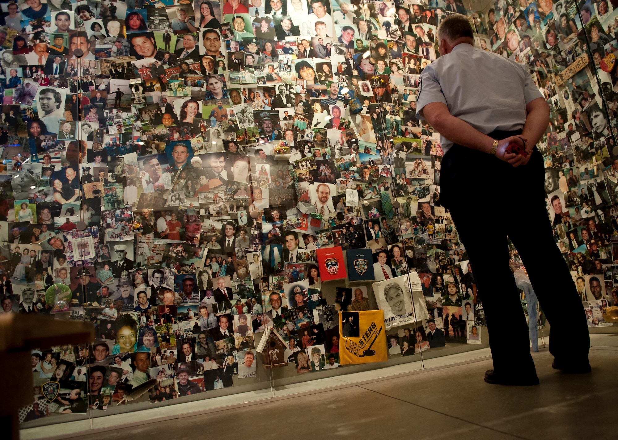 Senior Master Sergeant Wayne Hanna looks at the photos of the missing and dead men, women and children from the terrorist attacks at the World Trade Center Building on September 11, 2001, at the 9/11 Museum on August 20, 2012 in New York City. Hanna is from 76th Air Refueling Squadron at Joint Base McGuire-Dix-Lakehurst, N.J.  (U.S. Air Force photo/Senior Airman Andrew Lee)