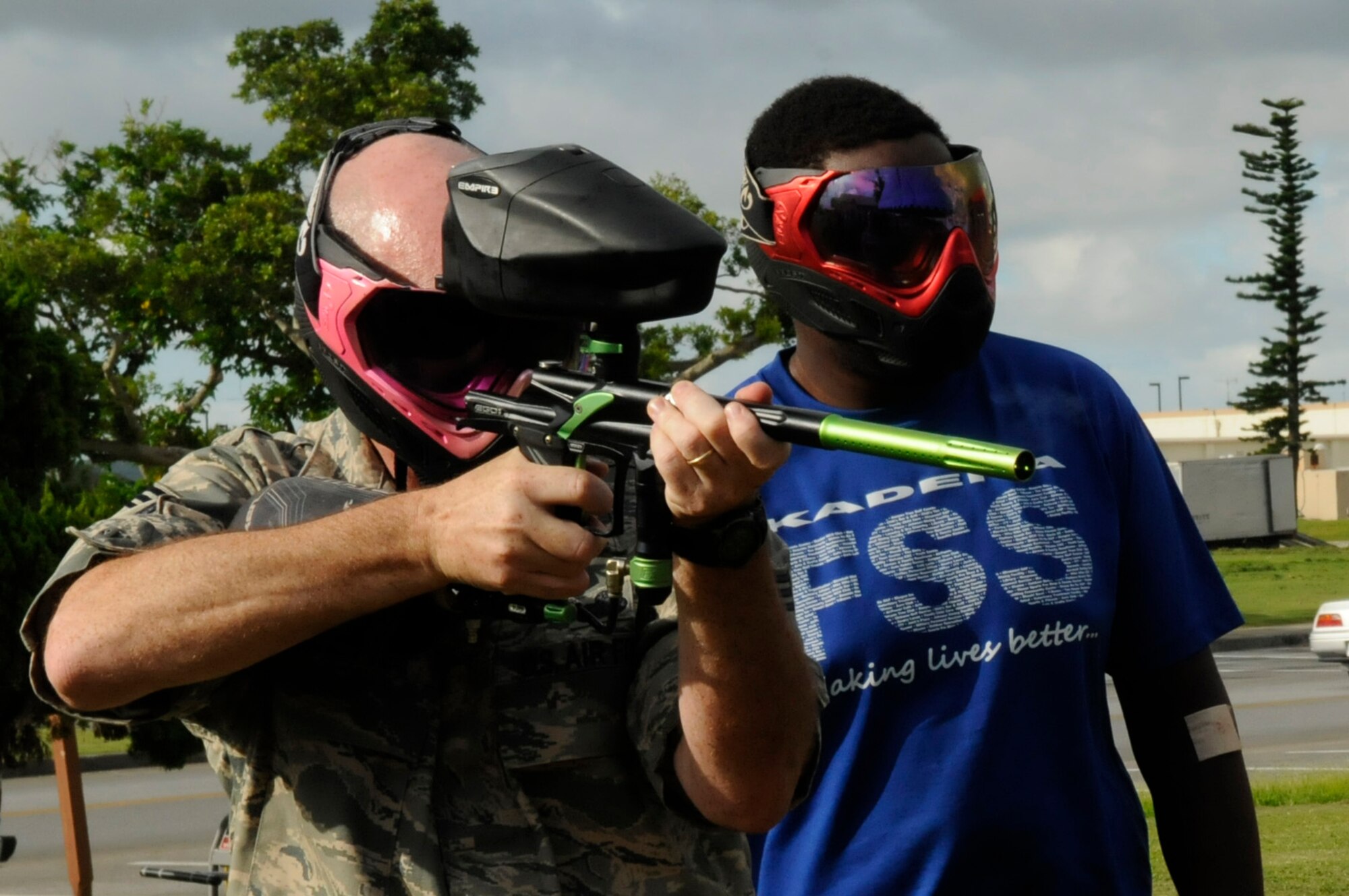 U.S. Air Force Chief Master Sgt. Kyle Robinette, Air Force Services functional manager, shows his skills with a paintball gun at the 18th Force Support Squadron's Outdoor Recreation Center during a tour of the 18th FSS facilities on Kadena Air Base, Japan, Aug. 17, 2012. Outdoor Recreation also rents camping gear, gardening, cleaning, sporting, inflatable toys and party equipment. (U.S. Air Force photo/ Airman 1st Class Tara A. Williamson)