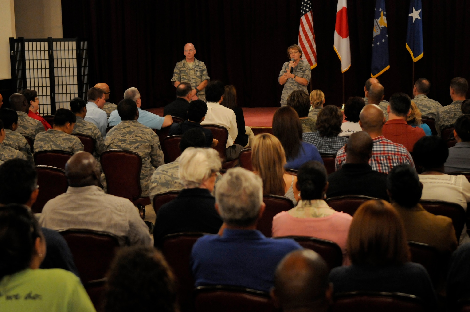 U.S. Air Force Brig. Gen. Eden Murrie, Air Force Services director, and Chief Master Sgt. Kyle Robinette, Air Force Services functional manager, talk to military and civilian members of the 18th Force Support Squadron during an all-call on Kadena Air Base, Japan, Aug. 17, 2012. Murrie and Robinette toured the 18th FSS facilities housed on both Kadena and Camp Kinser including the largest laundry and dry cleaning facility in the world and the only mortuary in the Pacific Command area of responsibility. (U.S. Air Force photo/ Airman 1st Class Tara A. Williamson)
