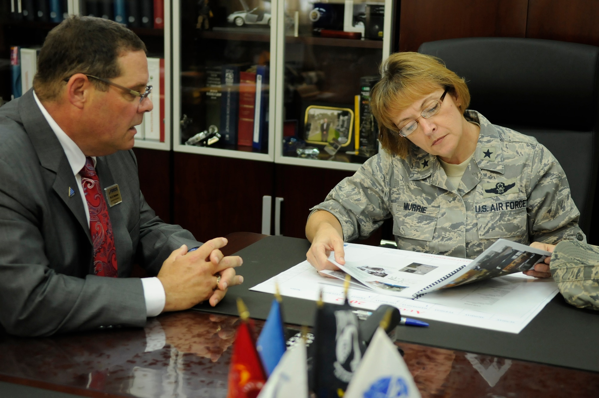 U.S. Air Force Brig. Gen. Eden Murrie, Air Force Services director, discusses the importance of the location of the mortuary with Robert Glassheim, 18th Force Support Squadron's Mortuary Affairs officer, during a tour of the 18th FSS facilities on Camp Kinser, Japan, Aug. 17, 2012. In addition to running the only mortuary in the Pacific Air Forces at Camp Kinser, the 18th FSS also runs dozens of facilities on Kadena Air Base, Japan. Murrie visited Okinawa as part of a Pacific Air Forces tour to become more familiar with overseas force support services. (U.S. Air Force photo/ Airman 1st Class Tara A. Williamson)