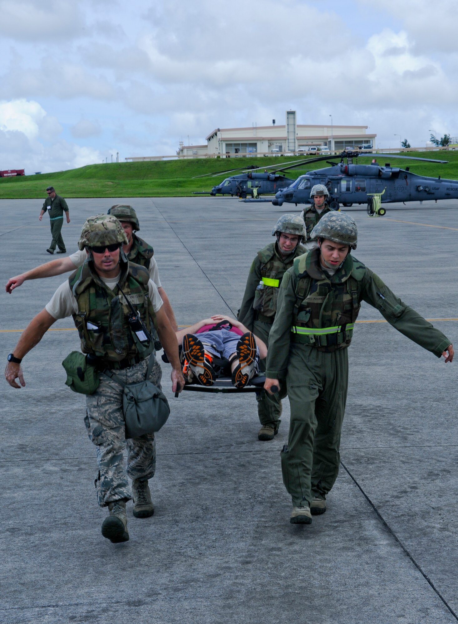 Airmen from the 18th Wing transport a simulated victim during local operational readiness exercise Beverly High 12-5 on Kadena Air Base, Japan, Aug. 21, 2012. Emergency responders provide training in prepararation for potential real world emergency situations (U.S. Air Force photo/Airman 1st Class Justin Veazie)
