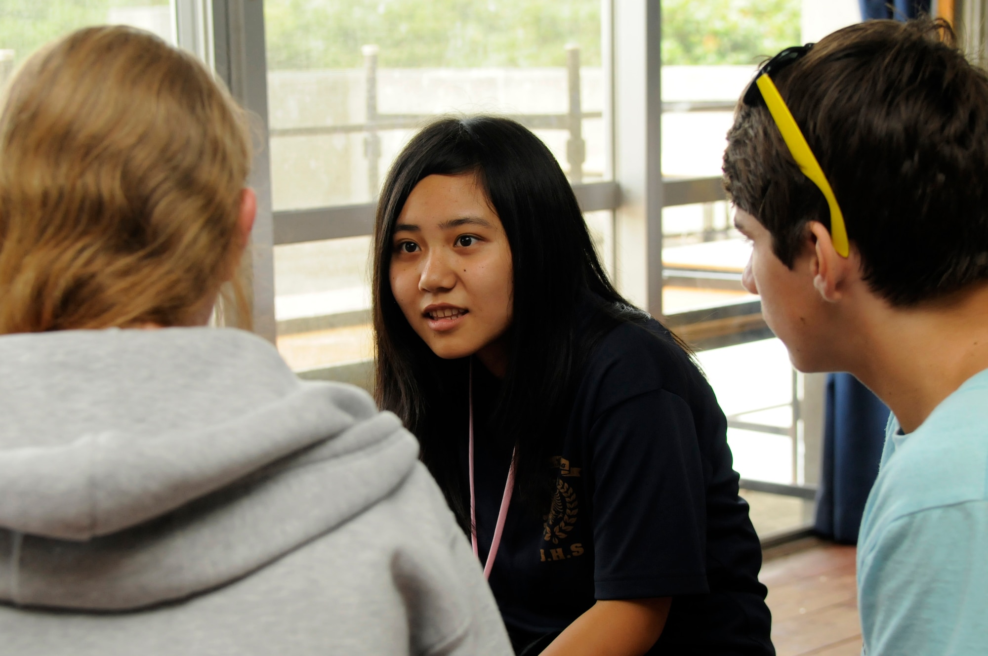 Akiyo Tomori, from Kamihara Junior High School, asks question to teens from Kadena Air Base during a youth exchange event in Nanjo City, Japan. This exchange helps the Okinawan teens practice their English with Kadena teens. (U.S. Air Force photo/Airman 1st Class Tara A. Williamson)