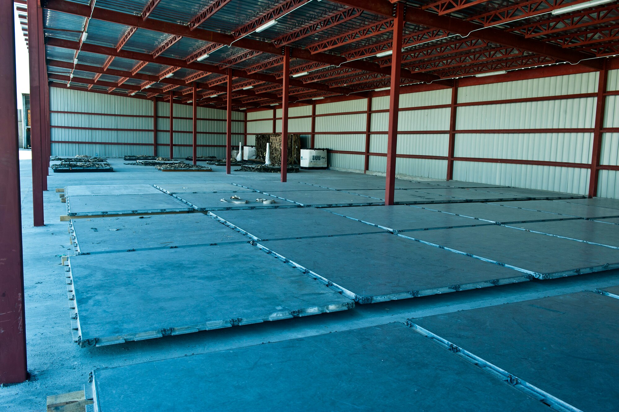 The weather shelter in the baggage yard holds more than 100 pallet positions at the Transit Center at Manas, Kyrgyzstan, Aug. 10, 2012. The shelter is a 57 percent increase in weather enclosed secure storage than the previous location. (U.S. Air Force photo/Senior Airman Brett Clashman)
