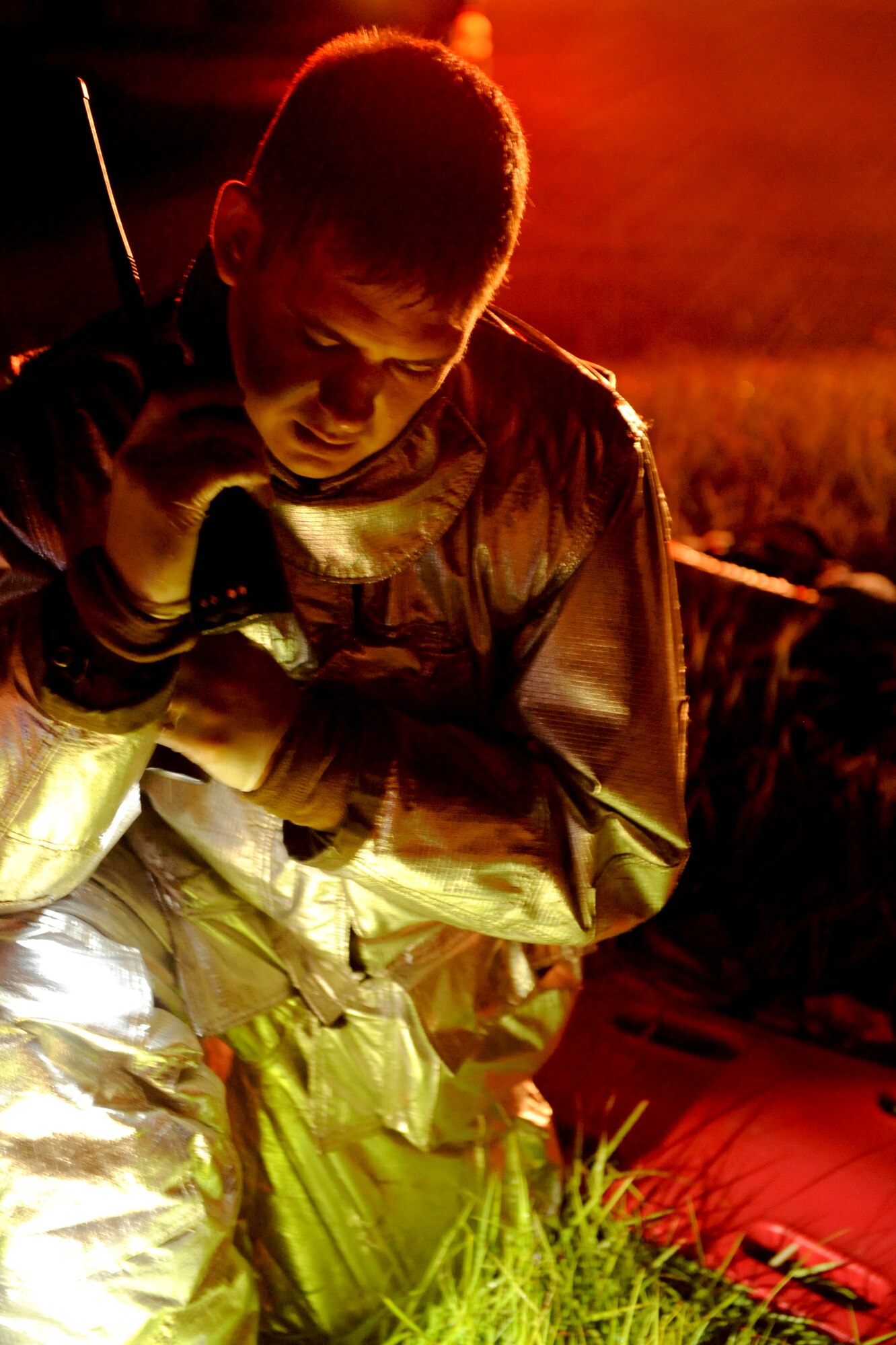 U.S. Air Force Staff Sgt. Noah Paxton, 18th Civil Engineer Squadron fire crew chief, radios dispatch about a training scenario during local operational readiness exercise Beverly High 12-5 on Kadena Air Base, Japan, Aug. 21, 2012. LOREs allow Airmen to train in a controlled environment and prepare themselves for future real world contingencies. (U.S. Air Force photo/Airman 1st Class Brooke P. Beers)