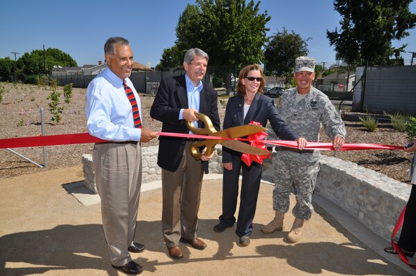 Officials cut the ribbon opening the Tujunga Wash Greenway to the public Aug. 15 in Valley Glen, Calif.  Pictured from left to right are Valley Glen Neighborhood Association President Carlos Ferreyra, County Supervisor Zev Yaroslavsky, Public Works Director Gail Farber and District Commander Col. Mark Toy.