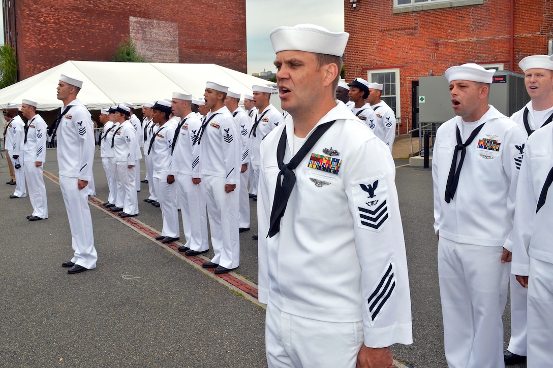 Navy chief petty officer selectees sing "Anchors Aweigh," in formation during the USS Constitution's Chief Petty Officer Heritage Week in Charlestown, Mass., Aug. 18, 2012. The selectees will live and train aboard the USS Constitution, the world's oldest commissioned warship.