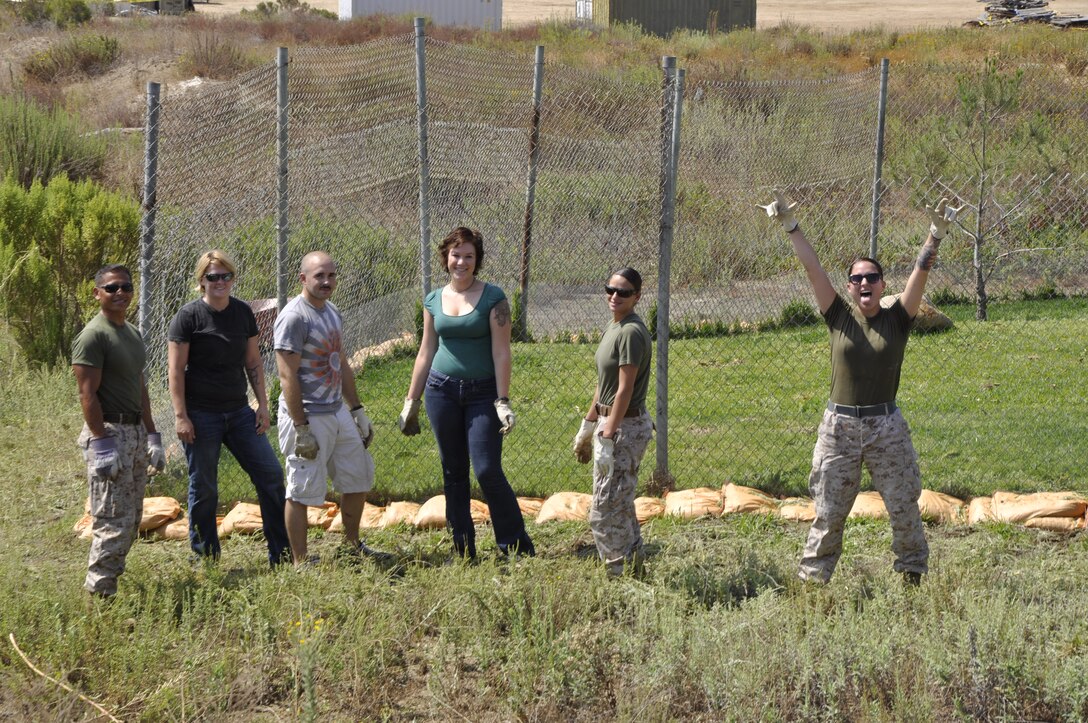 Camp Pendleton Marines gather for a group photo during a Single Marine Program volunteer event at the Camp Pendleton Animal Shelter, Aug.21.
