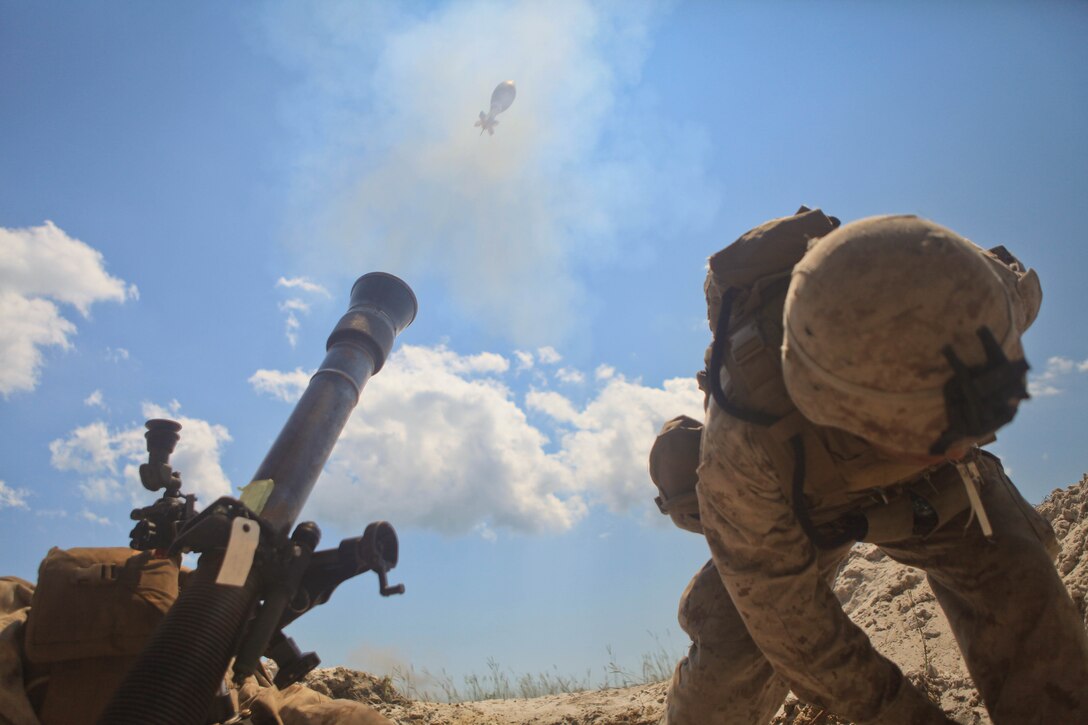 Private First Class Luis Rivera, an Oviedo, Fla. native and mortarman with Hellfire Platoon, Weapons Co., 3rd Battalion, 2nd Marine Regiment employs an 81mm mortar during a training exercise aboard base, August 14. Rivera and the other Marines of 3/2 conducted a two-day fire support coordination exercise August 14-15 in conjunction with artillery, naval guns and close air support.