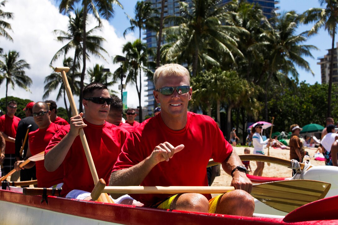 Gunnery Sgt. Brian J. Bennett, detachment gunnery sergeant for Wounded Warrior Battalion West – Hawaii Detachment, prepares to take off during Duke’s Ocean Fest Na Koa 2012 Canoe Race in the waters off the Hale Koa Hotel here Aug. 18. The team finished first in their heat during preliminary races. 