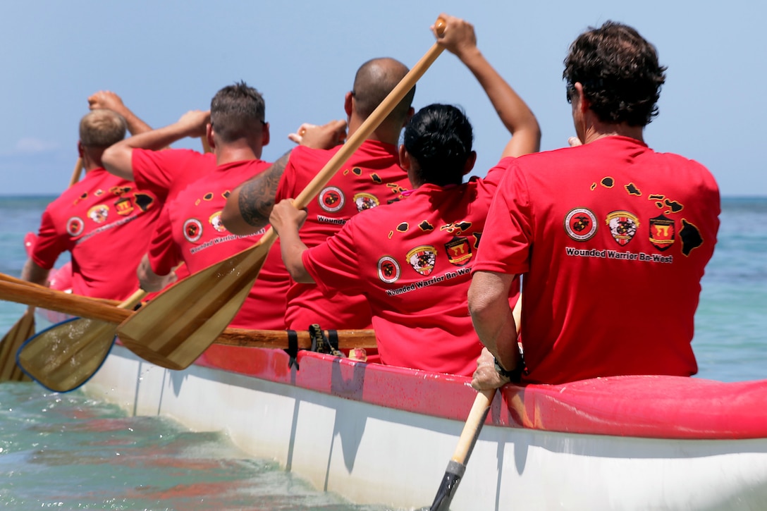 Marines represent Wounded Warrior Battalion West in Duke’s Ocean Fest Na Koa 2012 Canoe Race, which took place in the waters off the Hale Koa Hotel here Aug. 18. Although they didn’t win the competition, both Marine teams made it to the semifinal round.
