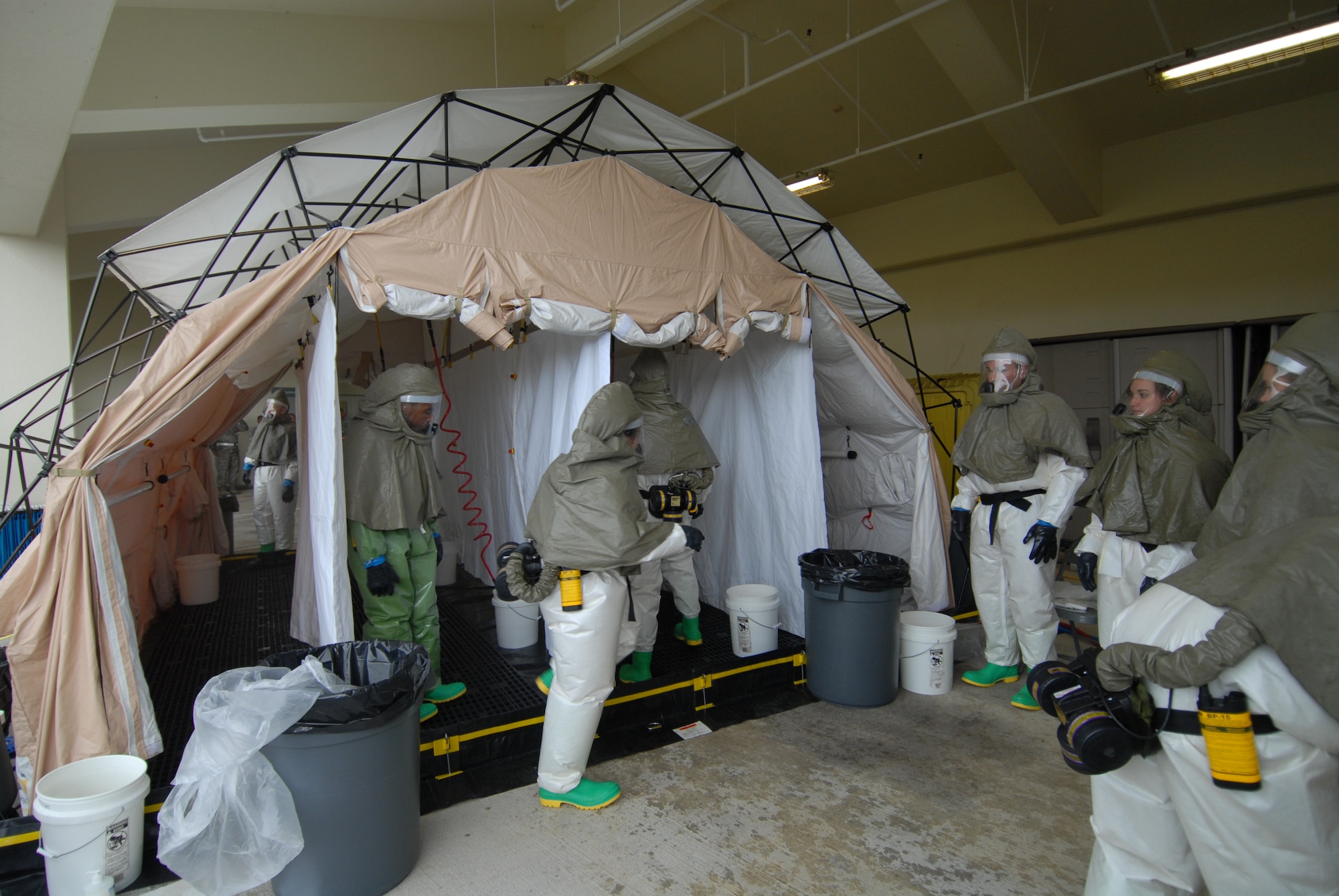 Members of the 18th Medical Group in-place patient decontamination team, prepare a decontamination station for a scenario during local operational readiness exercise Beverly High 12-5 on Kadena Air Base, Japan, Aug. 22, 2012. LOREs are designed to test, train and evaluate the base's ability to respond to any contingency in the region. (U.S. Air Force photo/Airman 1st Class Hailey R. Davis)