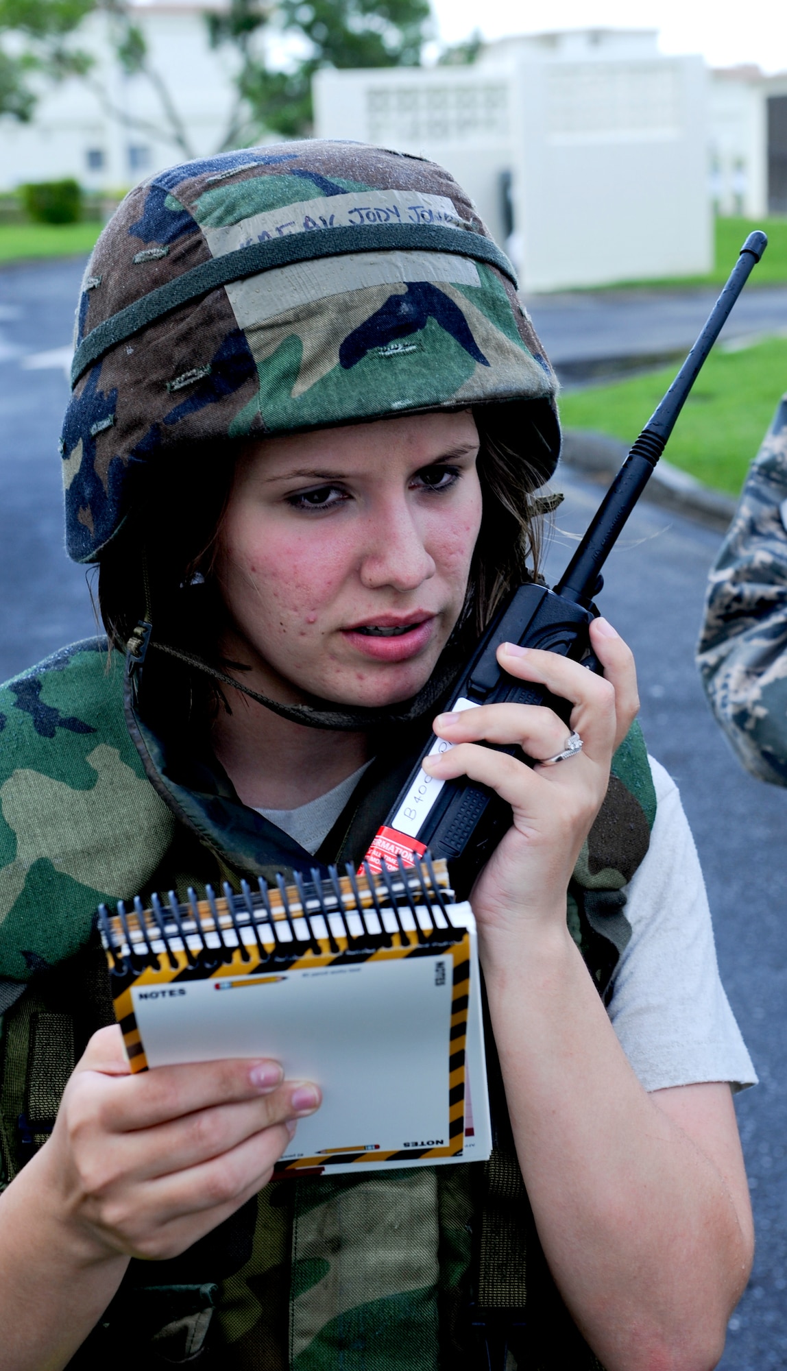 U.S. Air Force Airman 1st Class Jody Jones, 18th Communications Squadron client systems technician, radios the command center for updates on the post attack reconnaissance sweep during local operational readiness exercise Beverly High 12-5 on Kadena Air Base, Japan, Aug. 22, 2012. The week-long exercise is designed to test Kadena's Airmen on their ability to survive and operate in a multitude of scenarios in order to prepare them for real world contingencies. (U.S. Air Force photo/Airman 1st Class Justin Veazie)