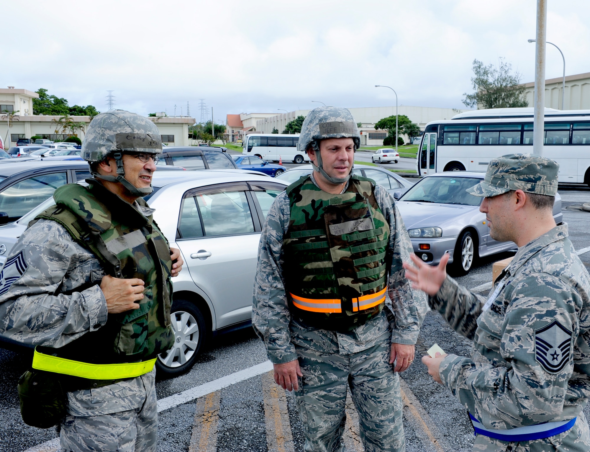 U.S. Air Force Airmen 1st Class Jody Jones and Jean-Luc Hurier, 18th Communications Squadron client system technicians, reference to their AFPAM 10-100 Airman's Manual on the post attack reconnaissance sweep during local operational readiness exercise Beverly High 12-5 on Kadena Air Base, Japan, Aug. 22, 2012. LOREs give Airmen a good opportunity to practice readiness skills and prepare for real world contingencies. (U.S. Air Force photo/Airman 1st Class Justin Veazie)