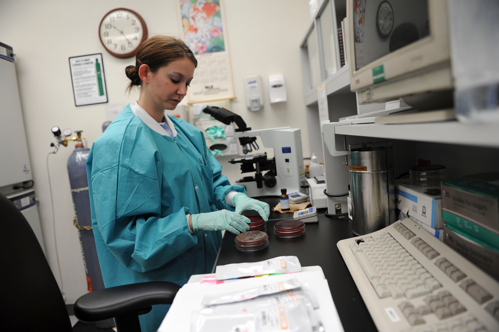 YOKOTA AIR BASE, Japan -- Airman 1st Class Jessica Bailey, 374th Medical Support Squadron medical laboratory, reads plates for isolation of bacteria from various sources at Yokota Air Base, Japan, July 23, 2012. The isolation of bacteria helps with diagnosis and treatment. (U.S. Air Force photo by Airman 1st Class Krystal M. Garrett)    
