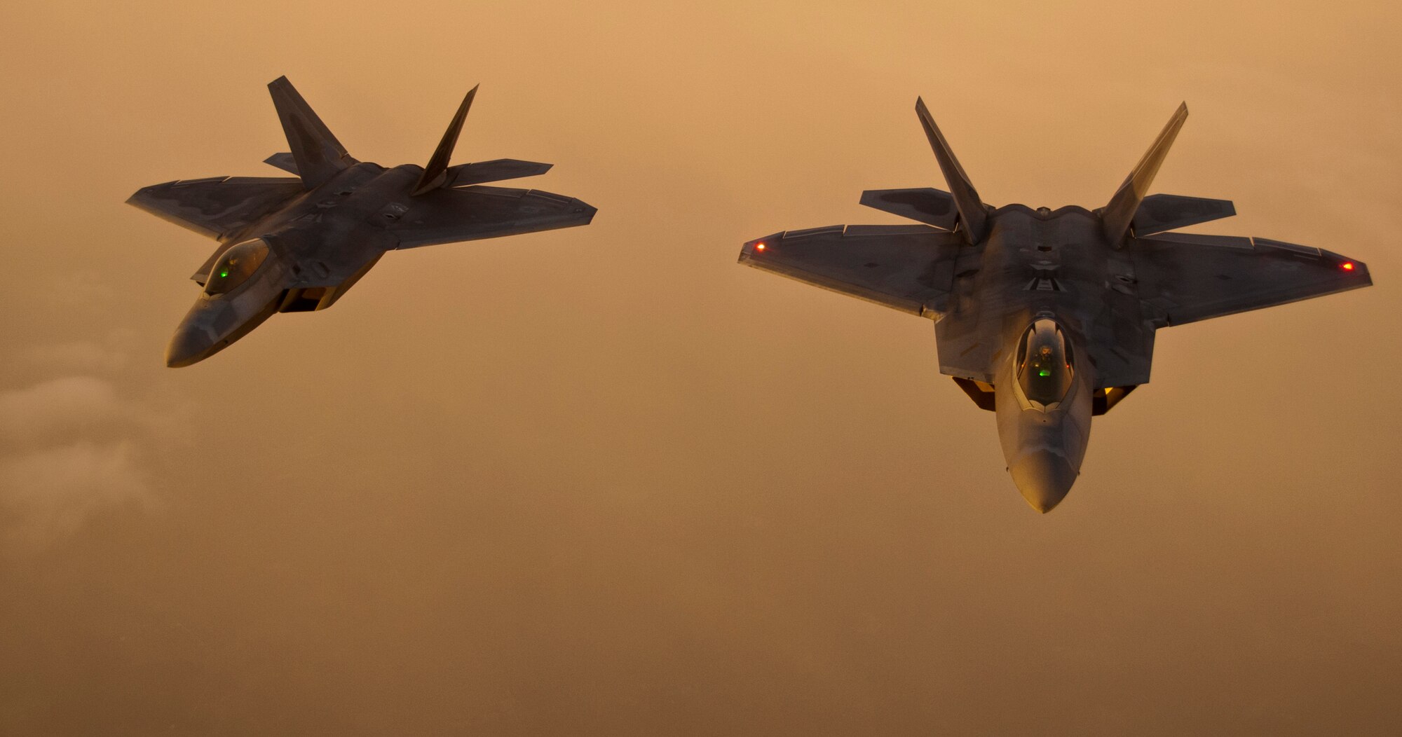 BROOKLYN, N.Y. -- F-22 Raptors from Tyndall Air Force Base, Fla. fly in formation behind a KC-135 Stratotanker from Altus Air Force Base, Okla. after an air refueling Aug. 21, 2012.The F-22s were refueled outside of New York in support of the Brooklyn Cyclone fly-over during Air Force Week. (U.S. Air Force photo by Airman 1st Class Kenneth W. Norman / Released / 97th Air Mobility Wing Public Affairs)