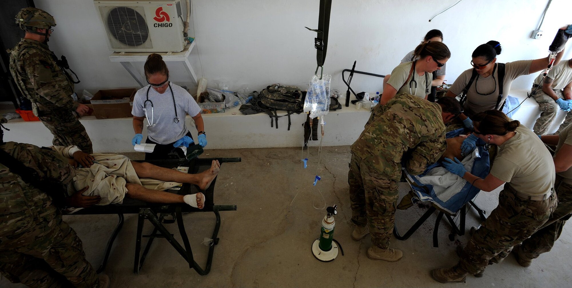 Tech Sgt. Vanessa Bibb (right) treats mass casualty victims while deployed to Afghanistan. Bibb was selected for the Secretary of the Air Force’s “Portraits in Courage” for 2012. (Courtesy Photo)