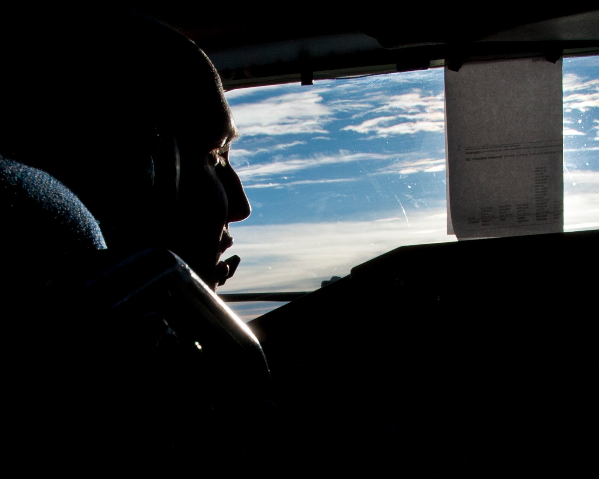 BROOKLYN, N.Y. -- Capt. Justin Cook, 54th Air Refueling Squadron, Altus Air Force Base, Okla., looks out the cockpit window during an air refueling mission, Aug. 21, 2012. The aircrew from the 54th ARS provided air refueling support for F-22 Raptors at the Brooklyn Cyclone fly-over during Air Force Week. (U.S. Air Force photo by Airman 1st Class Kenneth W. Norman / Released / 97th Air Mobility Wing Public Affairs)