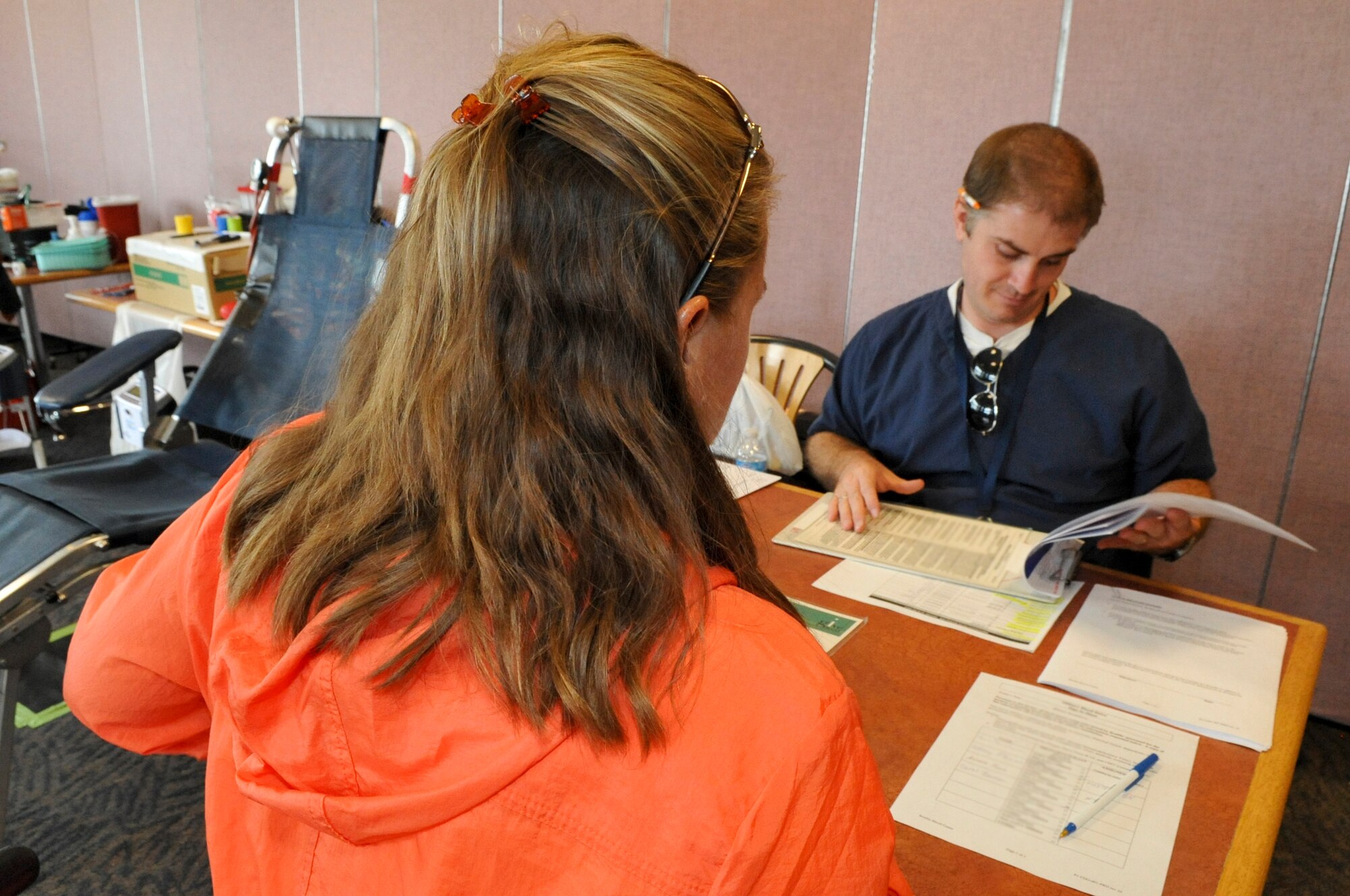 BUCKLEY AIR FORCE BASE, Colo. – A Bonfils Blood Center representative checks in a patient at Newtch’s Den Aug. 20, 2012. Bonfils is one of three locations for the Blood Bank of Colorado; the others are in Pueblo and Sterling. Those locations collect blood from people all across the state. Approximately 40 Team Buckley members donated blood.  (U.S. Air Force photo by Senior Airman Christopher Gross)