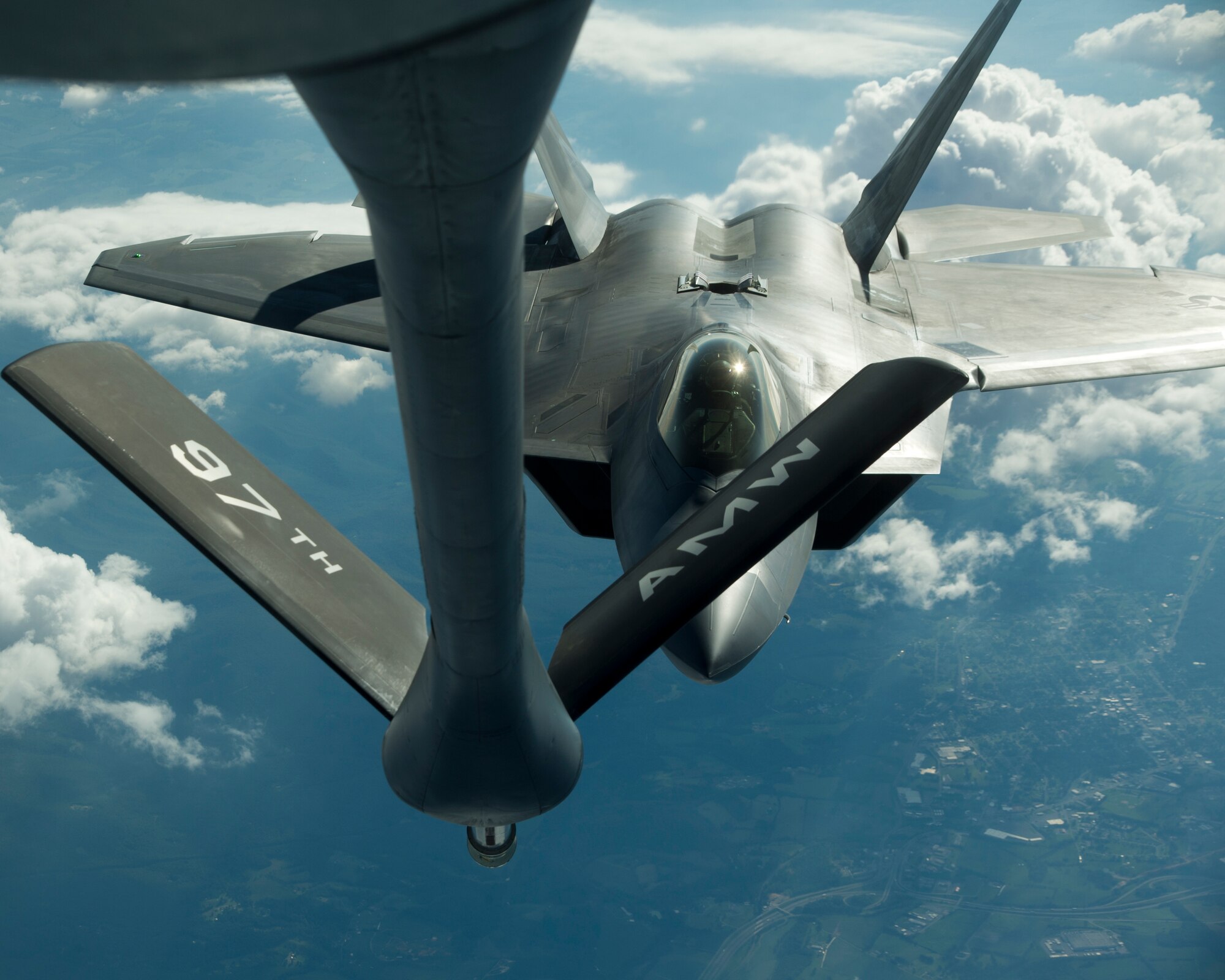 BROOKLYN, N.Y. -- An F-22 Raptor from Tyndall Air Force Base, Fla., moves into position behind a KC-135 Stratotanker from Altus AFB during an air refueling, Aug. 21, 2012.The F-22 was refueled outside of New York in support of the Brooklyn Cyclone fly-over during Air Force Week. (U.S. Air Force photo by Airman 1st Class Kenneth W. Norman / Released / 97th Air Mobility Wing Public Affairs)