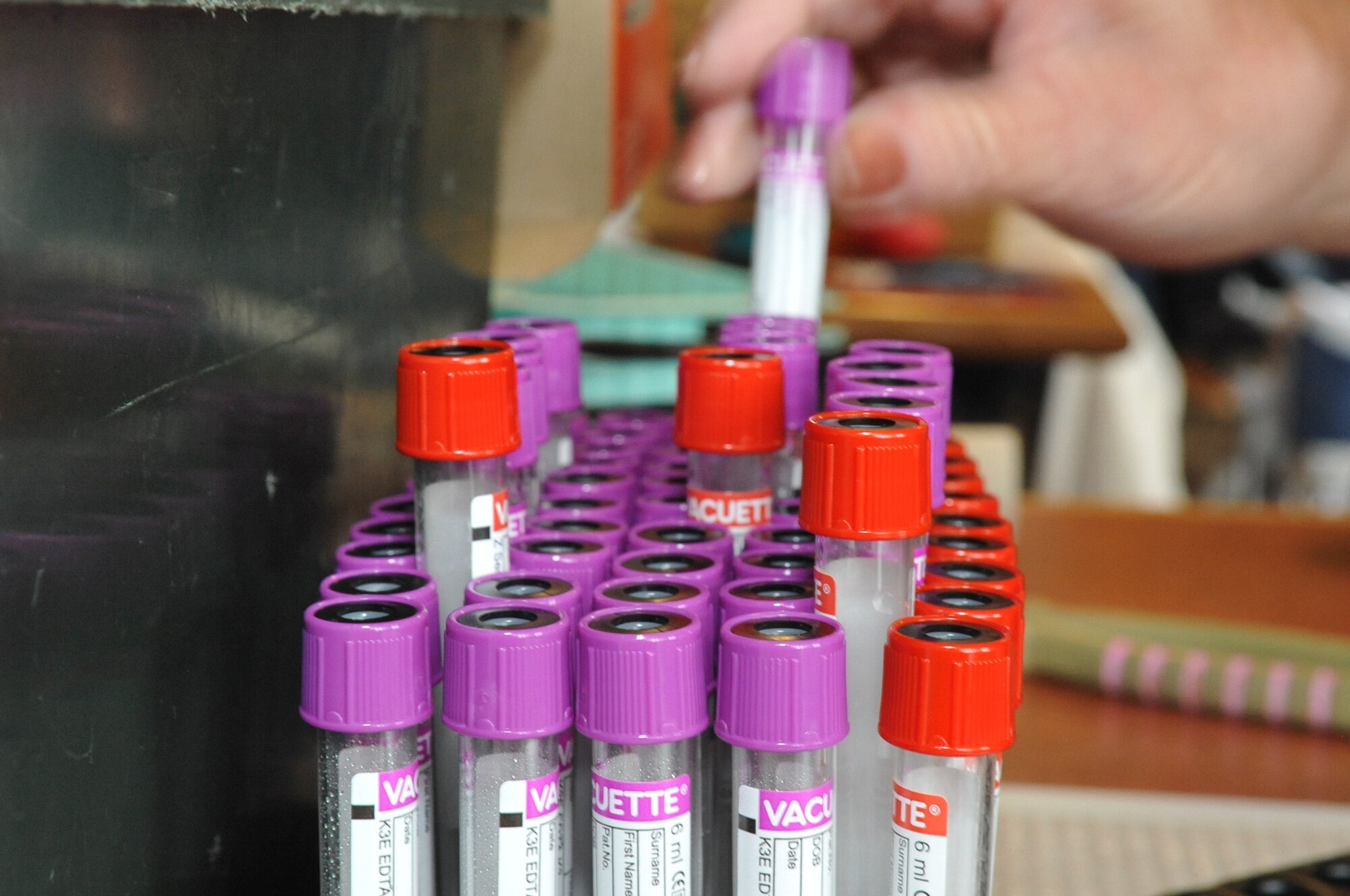 BUCKLEY AIR FORCE BASE, Colo. – Dianna Sax restocks test tubes at Newtch’s Den Aug. 20, 2012. Sax is with the Bonfils Blood Center in Denver. According the Bonfil’s website, they operate seven community donor centers, serve nearly 200 healthcare facilities in Colorado and beyond and they collect nearly 154,000 units of blood annually. (U.S. Air Force photo by Senior Airman Christopher Gross)