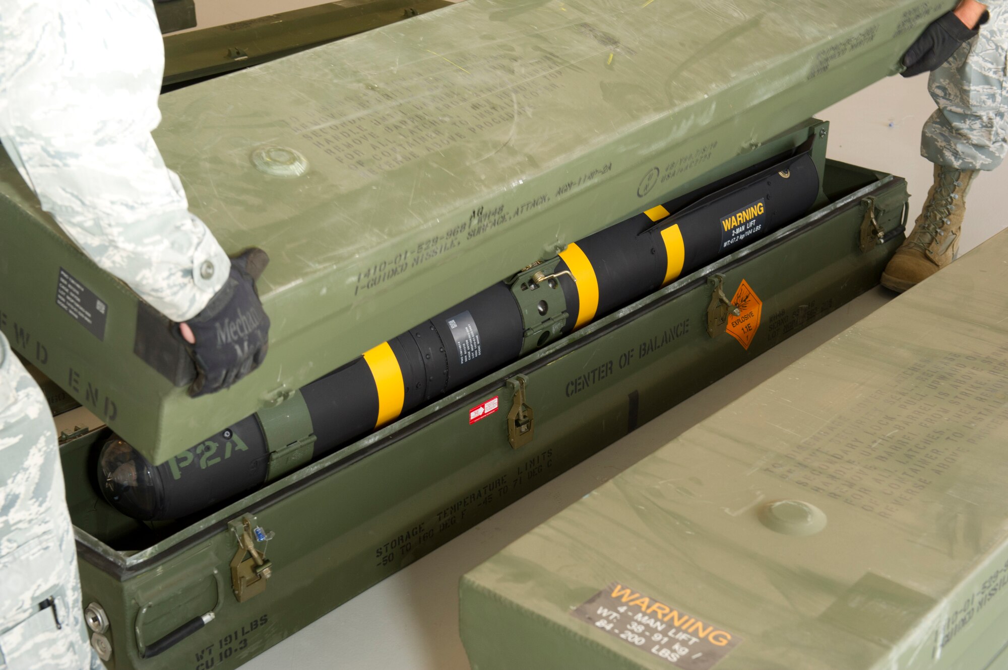 An AGM-114P Hellfire missile is prepared for shipment at the 49th Maintenance Squadron Munitions Flight on Holloman Air Force Base, N.M., Aug. 22. The missile is being sent back to its original owner’s location. Hellfire missiles were used during a joint training exercise that occurred between the sixth and ninth of Aug., that involved the U.S. Army, Cannon AFB, N.M., and Holloman AFB. The AGM-114P Hellfire missile system is a rocket-propelled, laser-guided weapon designed to defeat individual hard point targets. (U.S. Air Force Photo by Airman 1st Class Michael Shoemaker/Released)