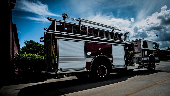 628th Civil Engineer Squadron fire fighters exit the fire department during a drill Aug. 9, 2012, at Joint Base Charleston – Air Base, S.C. The team has two minutes from notification of an emergency to be ready to leave the station. (U.S. Air Force photo/Senior Airman Dennis Sloan)
