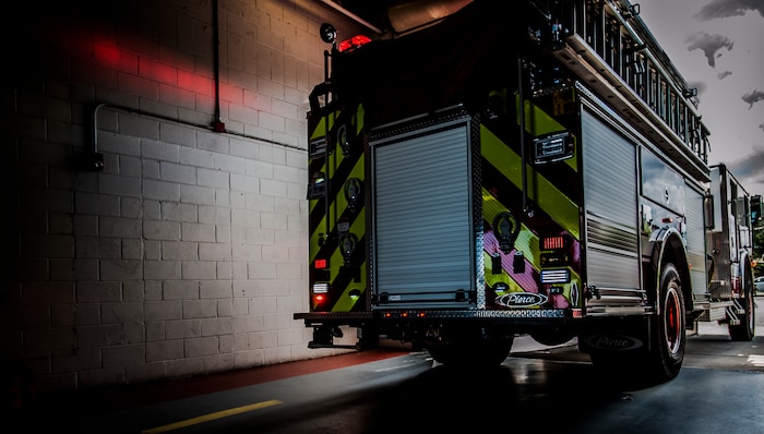628th Civil Engineer Squadron firefighters exit the fire department during a drill Aug. 9, 2012, at Joint Base Charleston, S.C. The firefighters have two minutes from notification of an emergency to be ready to leave the fire station. (U.S. Air Force photo/Senior Airman Dennis Sloan)