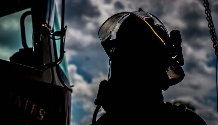 Staff Sgt. Anthony Ankeny, 628th Civil Engineer Squadron firefighter gets ready to jump on a fire truck during a drill Aug. 9, 2012, at Joint Base Charleston – Air Base, S.C. Each fire fighter has six pieces of equipment to put on in less than two minutes when responding to an emergency call. (U.S. Air Force photo/Senior Airman Dennis Sloan)
