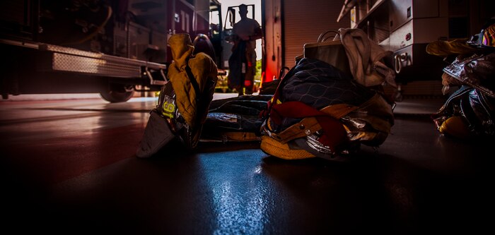 Staff Sgt. Zachary Welsh, 628th Civil Engineer Squadron firefighter, prepares to suit up during a drill Aug. 9, 2012, at Joint Base Charleston – Air Base, S.C. Each firefighter has six pieces of equipment to put on in less than two minutes when responding to an emergency call. (U.S. Air Force photo/Senior Airman Dennis Sloan)