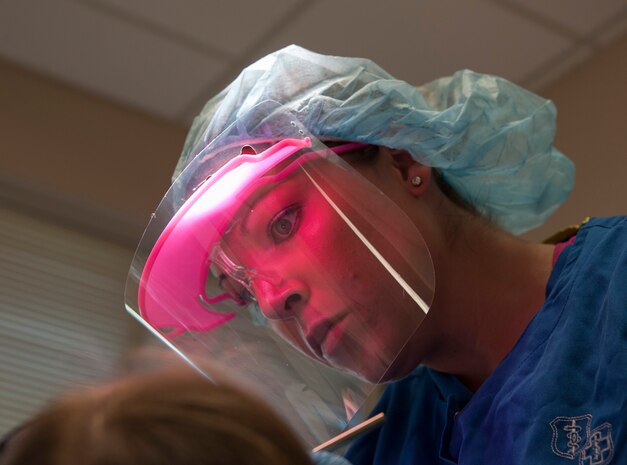 Senior Airman Tara Serrano, 628th Medical Group dental assistant, performs a routine dental exam on Staff Sgt. Sarah Strasen, 437th Operations Support Squadron airfield management training manager, during her dental appointment Aug. 17, 2012, at Joint Base Charleston - Air Base, S.C.  Dental assistants attend a two-month technical training school at Sheppard Air Force Base, Texas. (U.S. Air Force photo/Airman 1st Class Ashlee Galloway)