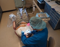 Senior Airman Tara Serrano, 628th Medical Group dental assistant, performs a routine dental exam on Staff Sgt. Sarah Strasen, 437th Operations Support Squadron airfield management training manager, during her dental appointment Aug. 17, 2012, at Joint Base Charleston - Air Base, S.C.  Dental assistants aid dentists in the performance of generalized tasks, including chair-side aid, clerical work, reception and some radiography and dental laboratory work. (U.S. Air Force photo/Airman 1st Class Ashlee Galloway)