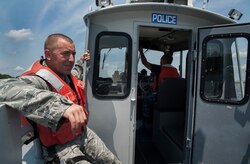 Staff Sgt. John Sweeney and Master-at-Arms Second Class Petty Officer Michael Jones, 628th Security Forces Squadron Harbor Patrol Unit, patrol the waterways Aug. 15, 2012 at Joint Base Charleston - Weapons Station, S.C. The Harbor Patrol Unit's mission is to protect the assets of JB Charleston. The officers patrol 24 hours a day, seven days a week and cover 16 square miles of water around the base. (U.S. Air Force photo/Airman 1st Class Ashlee Galloway)
