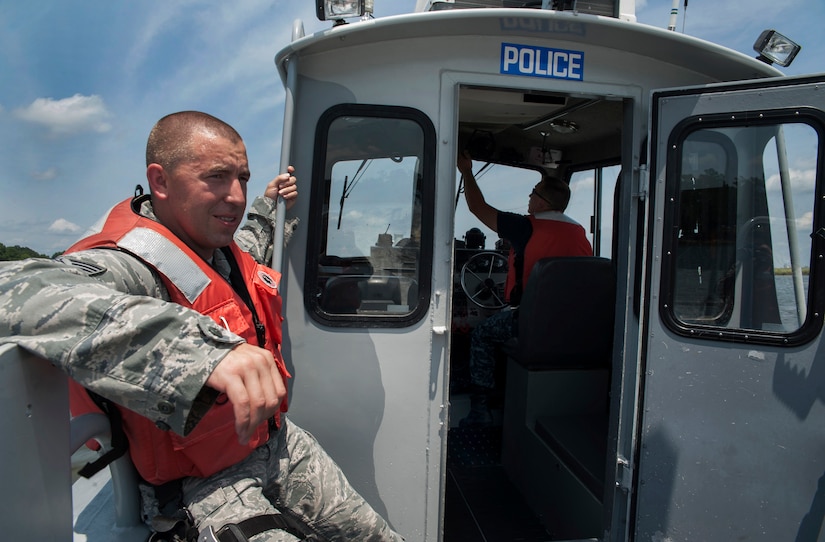 Staff Sgt. John Sweeney and Master-at-Arms Second Class Petty Officer Michael Jones, 628th Security Forces Squadron Harbor Patrol Unit, patrol the waterways Aug. 15, 2012 at Joint Base Charleston - Weapons Station, S.C. The Harbor Patrol Unit's mission is to protect the assets of JB Charleston. The officers patrol 24-hours a day, seven days a week and cover 16-square miles of water around the base. (U.S. Air Force photo/Airman 1st Class Ashlee Galloway)