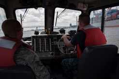 Staff Sgt. John Sweeney and Master-at-Arms Second Class Petty Officer Michael Jones, 628th Security Forces Squadron Harbor Patrol Unit, patrol the Cooper River Aug. 15, 2012 at Joint Base Charleston - Weapons Station, S.C. The Harbor Patrol Unit's mission is to protect the assets of JB Charleston. The officers patrol 24 hours a day, seven days a week and cover 16 square miles of waterways around the JB Charleston – Weapons Station. (U.S. Air Force photo/Airman 1st Class Ashlee Galloway) 
