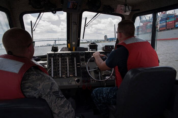 Staff Sgt. John Sweeney and Master-at-Arms Second Class Petty Officer Michael Jones, 628th Security Forces Squadron Harbor Patrol Unit, patrol the Cooper River Aug. 15, 2012 at Joint Base Charleston - Weapons Station, S.C. The Harbor Patrol Unit's mission is to protect the assets of JB Charleston. The officers patrol 24-hours a day, seven days a week and cover 16-square miles of waterways around the JB Charleston – Weapons Station. (U.S. Air Force photo/Airman 1st Class Ashlee Galloway)