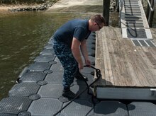 Master-at-Arms Second Class Petty Officer Michael Jones, 628th Security Forces Squadron Harbor Patrol Unit, ties down a Sea Ark boat after a patrol Aug. 15, 2012, at Joint Base Charleston - Weapons Station, S.C. The 628th SFS officers patrol the waterways around the base 24 hours a day, seven days a week. (U.S. Air Force photo/Airman 1st Class Ashlee Galloway) 
