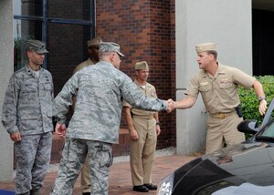Col. Richard McComb, Joint Base Charleston commander, greets Rear Adm. John "Jack" Scorby Jr., Navy Region Southeast commander, at Joint Base Charleston – Air Base, S.C., Aug. 16, 2012. Scorby is responsible for 17 shore facilities across the Southeast United States and Caribbean. Scorby visited facilities on JB Charleston – Air Base and JB Charleston – Weapons Station. (U.S. Air Force photo/ Staff Sgt. Rasheen Douglas)