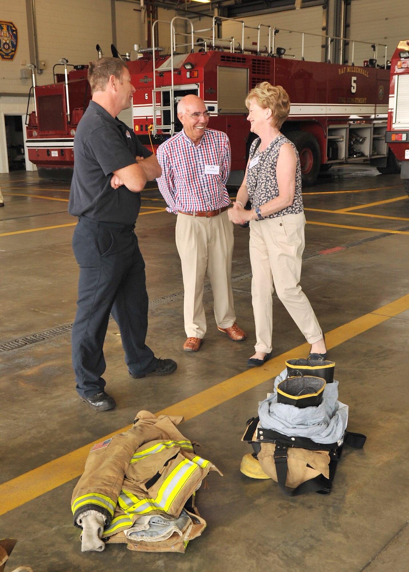 RAF MILDENHALL, England – From left, Ian Nichols, 100th Civil Engineer Squadron, speaks to Ken Thompson, British-American Committee, and Patricia Levrington about the duties of the firefighters Aug. 21, 2012, at the base fire department. Eight members of the local community were selected by the British-American Committee for their support of the base and its mission. (U.S. Air Force photo/Senior Airman Jerilyn Quintanilla)