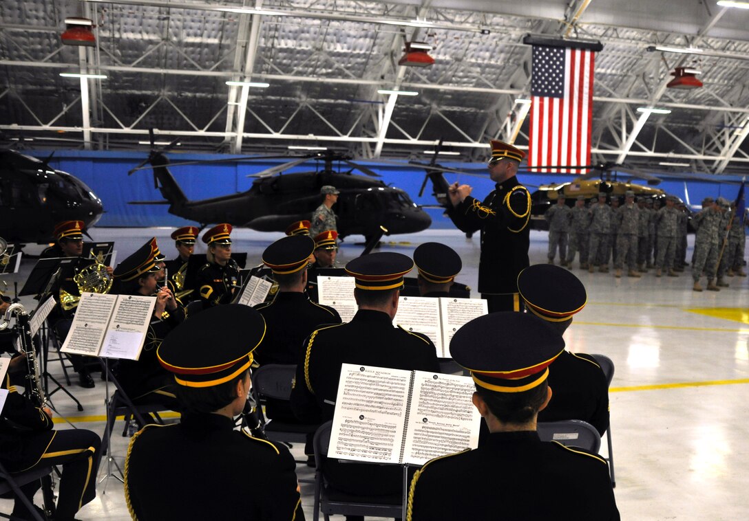 The U.S. Army Band “Pershing’s Own” performs prior to the start of a U.S. Army Air Operations Group change of command ceremony in Hangar 3 Aug. 16, 2012. Along with the U.S. Army Air Operations Group, Pershing’s Own is headquartered at Fort McNair in Washington, D.C. Additionally, “Pershing’s Own” is the premiere U.S. Army Band of the East Coast and is known for their performances throughout the National Capital Region. (U.S. Air Force photo/Senior Airman Lindsey A. Porter)