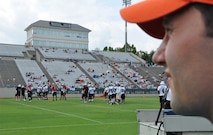 Capt. Derrick Baker, 911th ARS pilot, watches the Carolina Panthers from the sidelines of Wofford College's stadium on Aug. 10, 2012. Baker was selected to for the USO/Carolina Panthers Military VIP Experience. (USAF photo by Maj. Shannon Mann, 916ARW/PA)