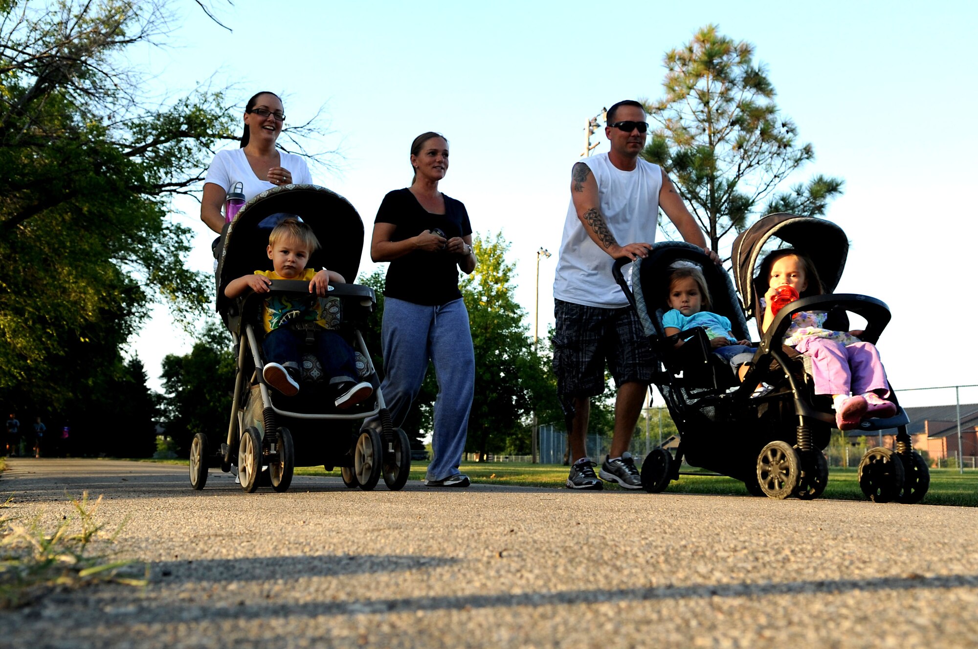 Base residents finish the “Run for the Fallen” 5K event on Grand Forks Air Force Base, N.D., on Aug. 17, 2012. More than 60 participants covered a total of 198.4 miles in support of fallen service members from Operations Iraqi Freedom and Enduring Freedom. (U.S. Air Force photo/ Staff Sgt. Amanda Grabiec)