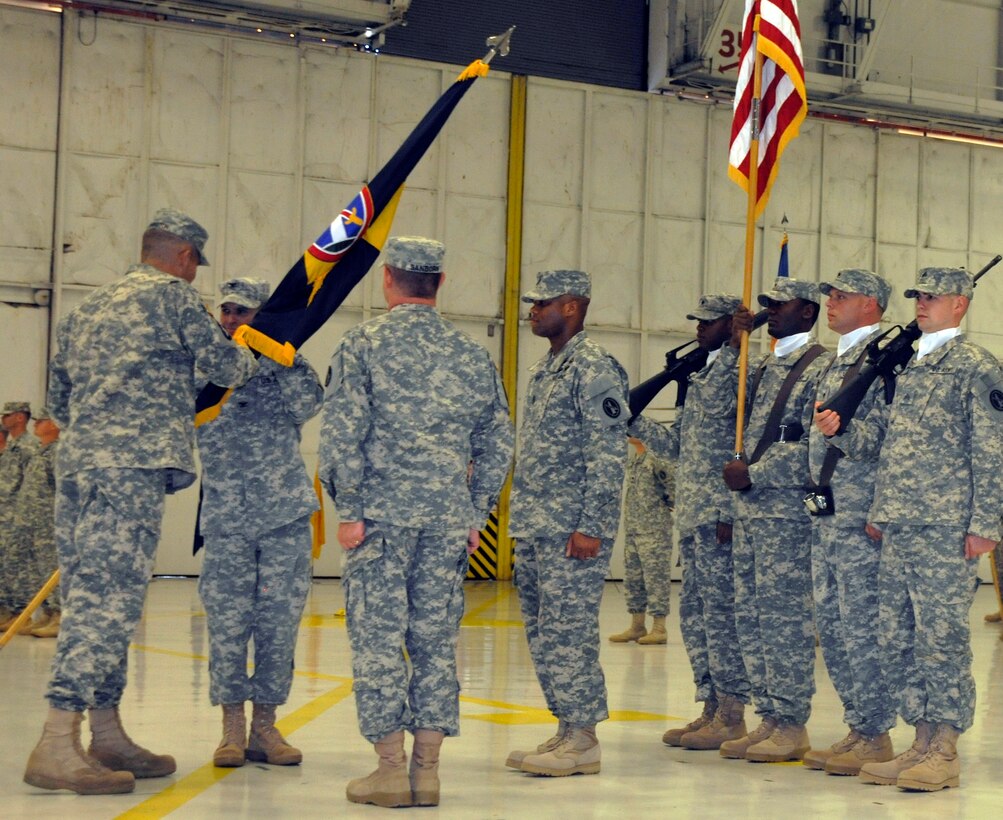 Army Maj. Gen. Michael S. Linnington, commanding general United States Military District of Washington and commander, Joint Force Headquarters National Capital Region, far left, passes the U.S. Army Air Operations Group guidon to Col. William D. McGarrity Aug. 16, 2012. McGarrity took command of the U.S. Army Air Operations Group from Col. Scott E. Sanborn. The U.S. Army Air Operations Group is headquartered at Fort McNair in Washington, D.C.  (U.S. Air Force photo/Senior Airman Lindsey A. Porter)