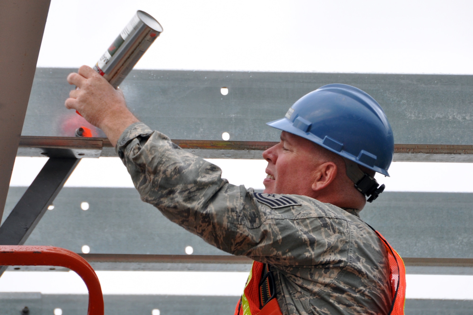 Tech. Sgt. Russell Kinnard, a heating, ventilation, air conditioning and refrigeration technician assigned to the 307th Civil Engineer Squadron from Barksdale Air Force Base, La., marks his work at Youngstown Air Reserve Station, Vienna, Ohio, Aug. 14, 2012. Fasteners were marked with easily seen paint to signify they had been tightened during the construction of a Pre-Engineered building on base. Kinnard was part of a 29-person detail from Barksdale that spent two weeks at Youngstown ARS assisting 910th Civil Engineer Squadron personnel build a Prime Base Engineer Emergency Force (Prime BEEF) training area. (U.S. Air Force photo by Master Sgt. Jeff Walston)