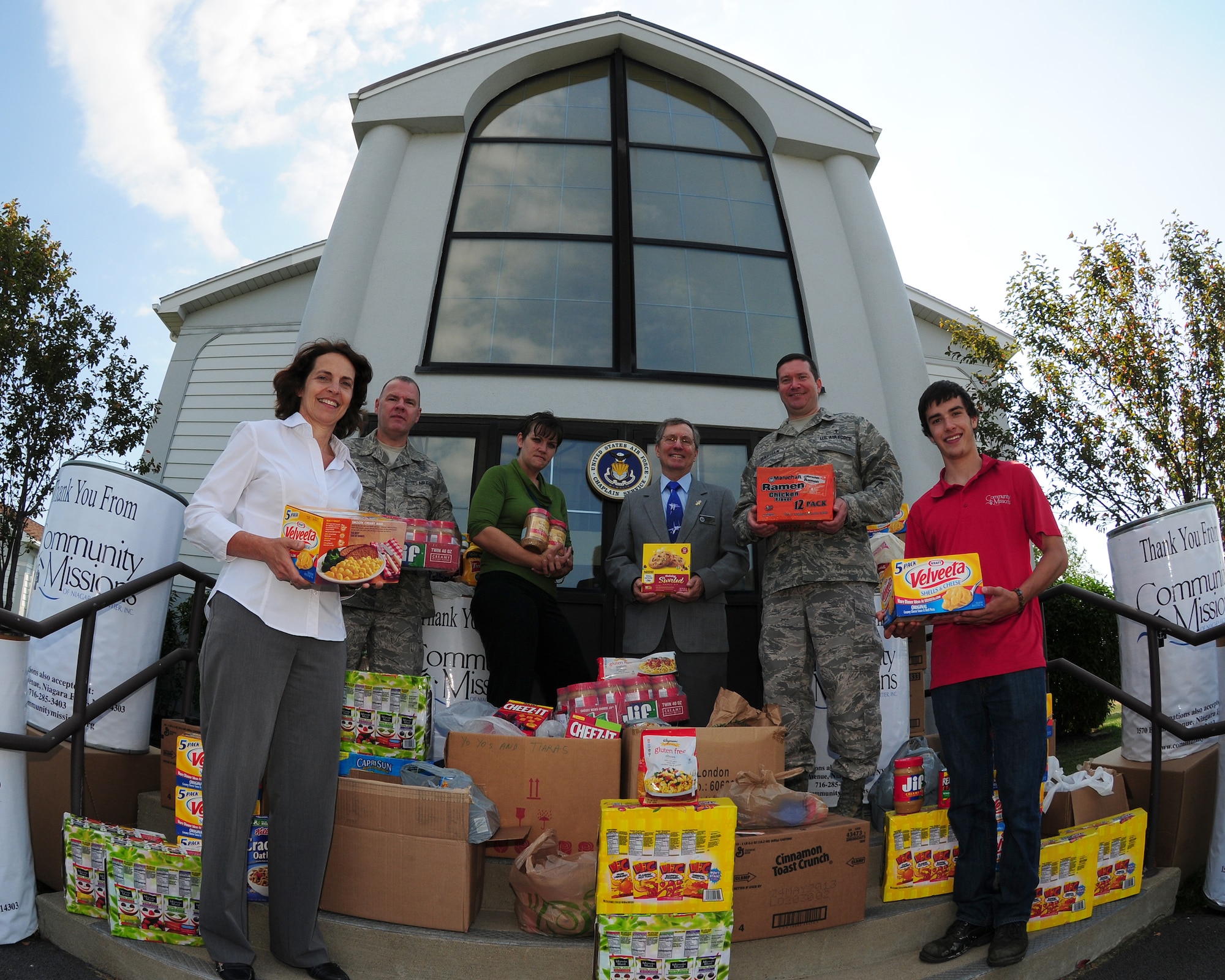 Enough food to feed many local families in need!  (L to R) Ms. Patty Braun,  Executive Officer, 914th Airlift Wing, Technical Sgt. Terry Jones, Chaplain Assistant, 914th Airlift Wing, Ms.Katie Trombley, Public Relations and Development Manager for Community Missions of Niagara, Mr. Jim Germain, Family Readiness Director, 914th Airlift Wing, Capt. Jim Bastian, Chaplain, 914th Airlift Wing, and Mr.Patrick Summers, of Community Missions display some of the food that was donated by employees of the Niagara Falls Air Reserve Station, NY on August 22, 2012. The food was donated as part of a nationwide Depart of Defense program called "Feds Feed Families." (US Air Force photo by Peter Borys)